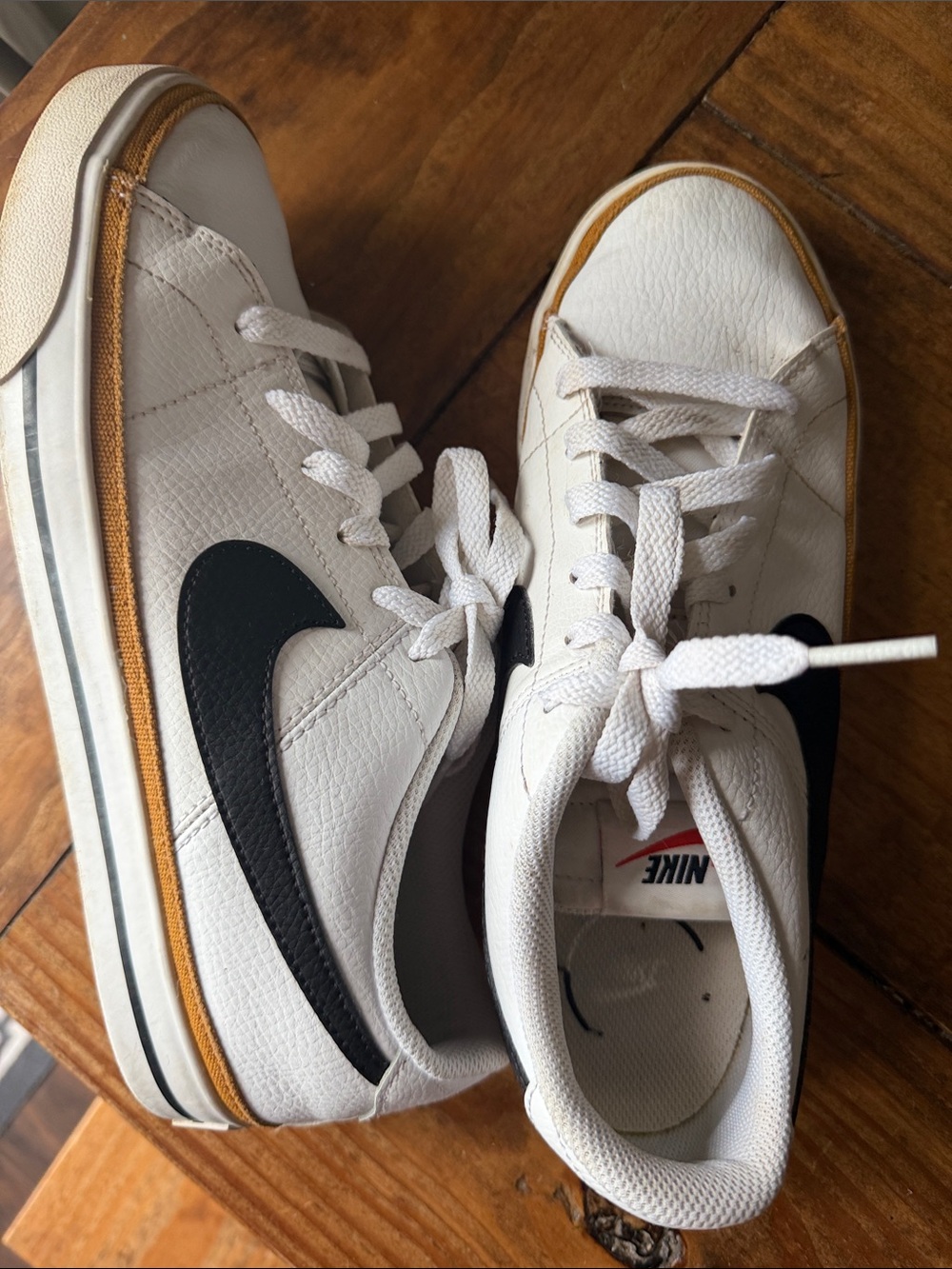 Nike White Leather Low-Top Sneakers with Black Swoosh and Tan Accent